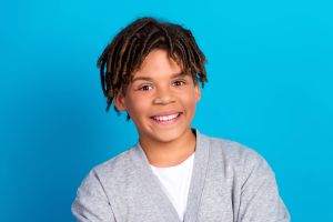 Smiling boy on blue background