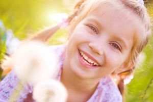 Smiling child in outdoor setting